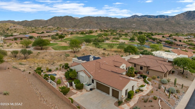 birds eye view of property featuring a mountain view