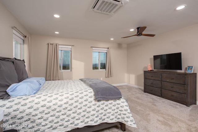 bedroom with ceiling fan and light colored carpet