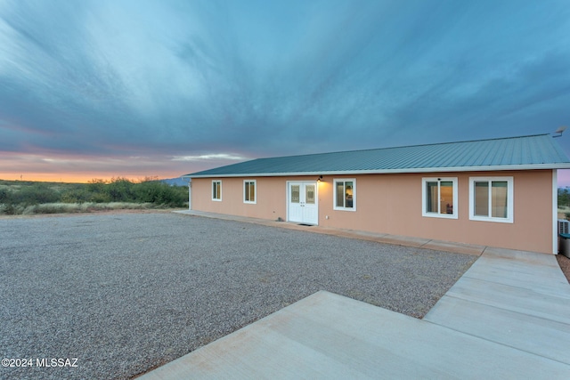 2222 W Stormy Trl, Benson, AZ 85602 - rear view of house featuring a patio area, metal roof, and french doors