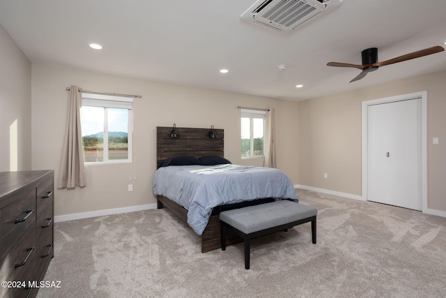 carpeted bedroom with ceiling fan