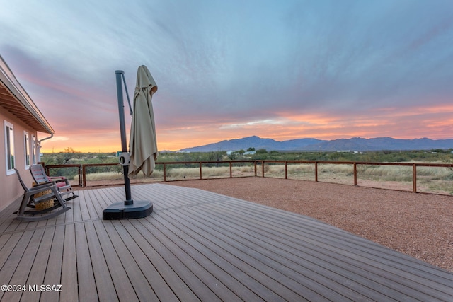 deck at dusk with a mountain view