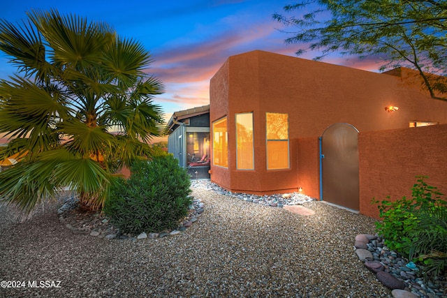 view of property exterior at dusk