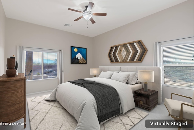 bedroom with light colored carpet and ceiling fan