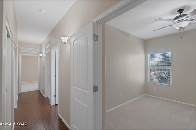 hallway featuring dark hardwood / wood-style floors