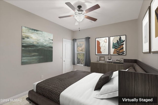 carpeted bedroom featuring ceiling fan