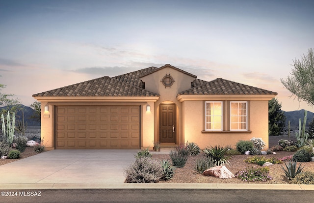 view of front facade featuring a mountain view and a garage