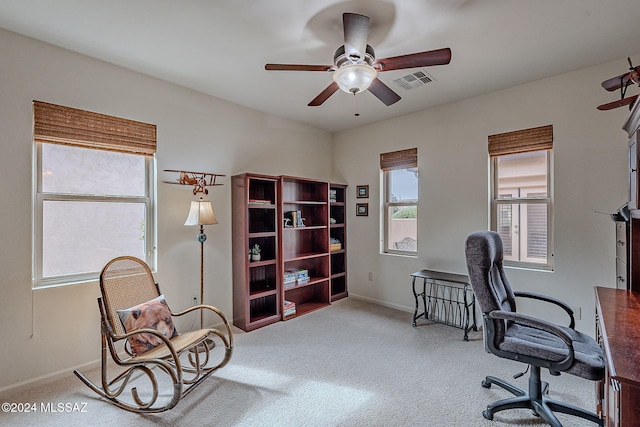 office area featuring ceiling fan and carpet