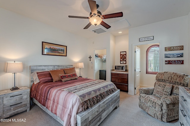 bedroom with ceiling fan and light colored carpet