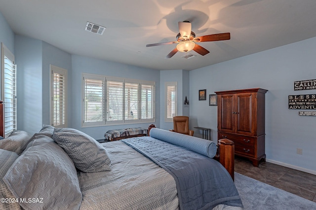 tiled bedroom with ceiling fan