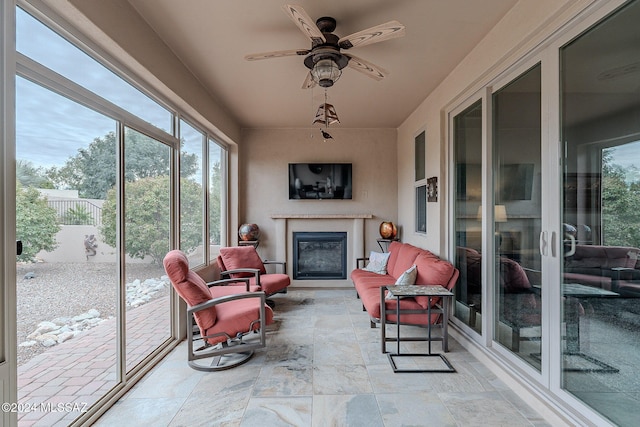 sunroom with ceiling fan