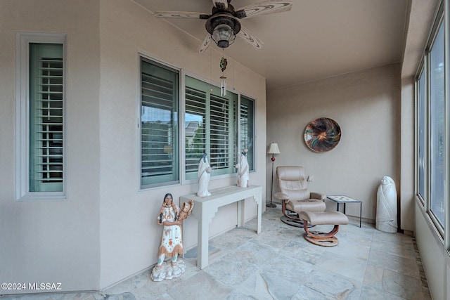 exterior space with ceiling fan