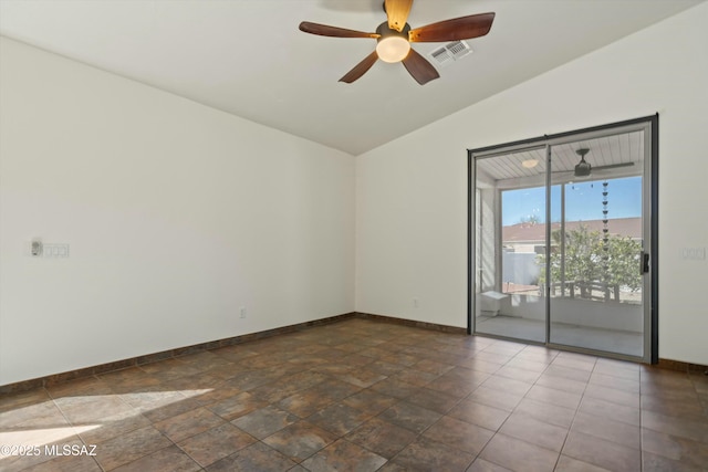 spare room featuring ceiling fan, baseboards, visible vents, and vaulted ceiling