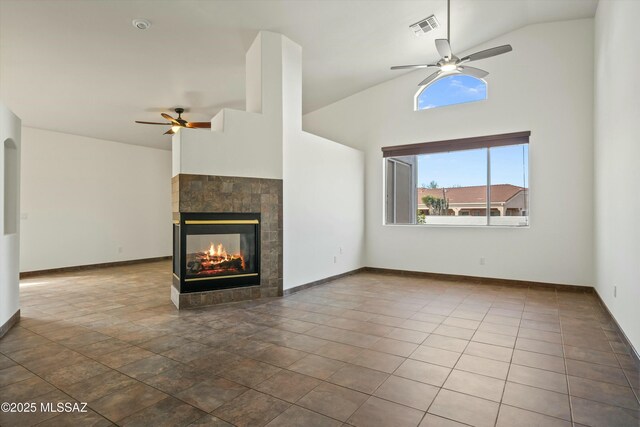 foyer entrance featuring ceiling fan with notable chandelier and high vaulted ceiling