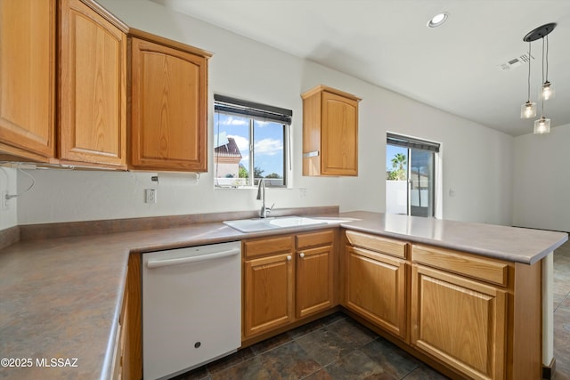 kitchen featuring decorative light fixtures, light countertops, a sink, dishwasher, and a peninsula