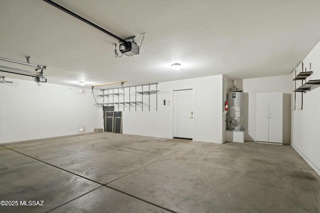 garage with gas water heater and a garage door opener