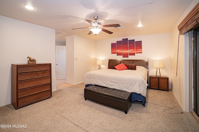 bedroom featuring light colored carpet and ceiling fan