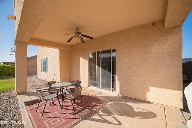 view of patio featuring ceiling fan