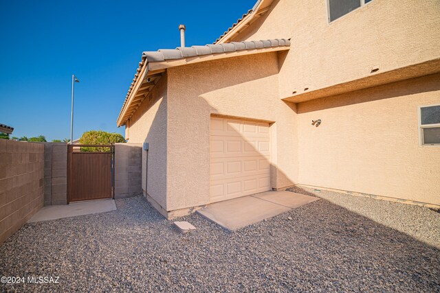 view of side of home with a garage