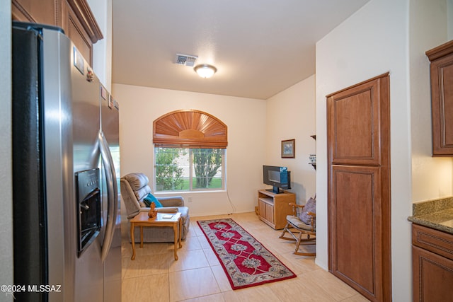 living area featuring light tile patterned flooring