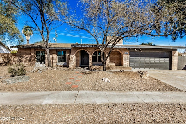 ranch-style home featuring a garage