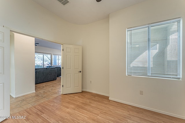 spare room with light hardwood / wood-style flooring