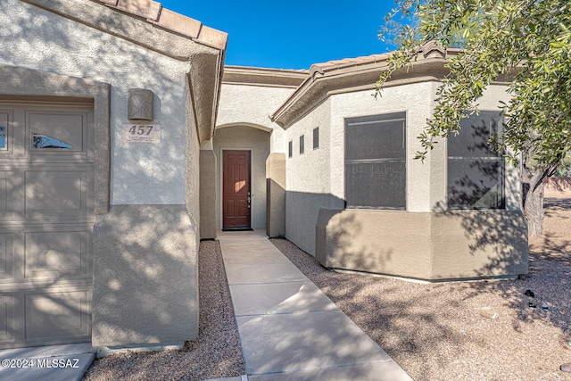 entrance to property featuring a garage