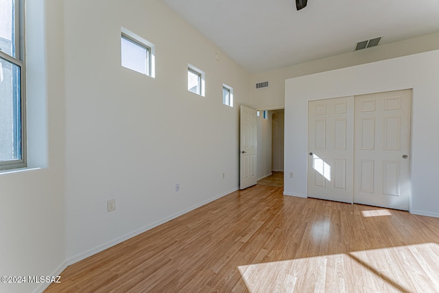 interior space with light hardwood / wood-style floors and a closet