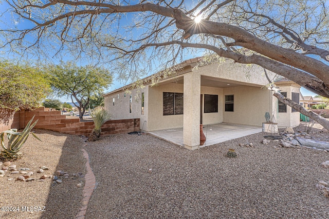 rear view of house with a patio