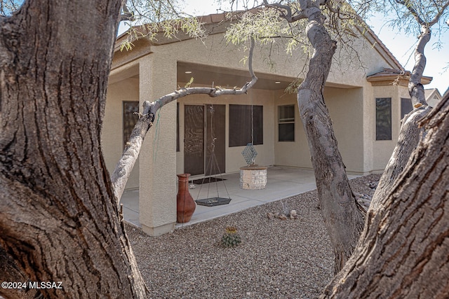 rear view of property featuring a patio