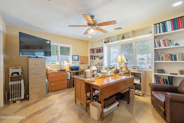 office with ceiling fan and plenty of natural light