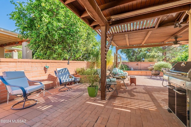 view of patio / terrace with ceiling fan, a grill, and a pergola