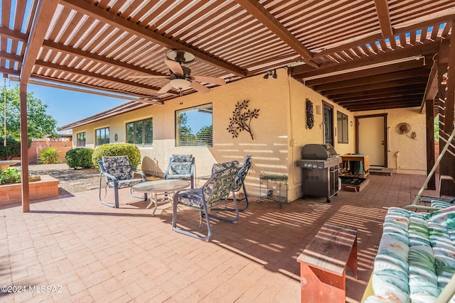 view of patio featuring a pergola, ceiling fan, and a grill