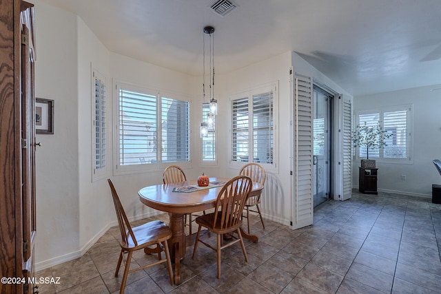 tiled dining space with a wealth of natural light