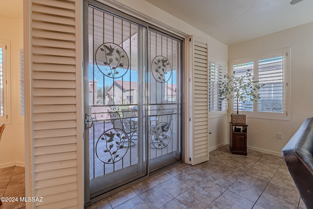 foyer with tile patterned floors