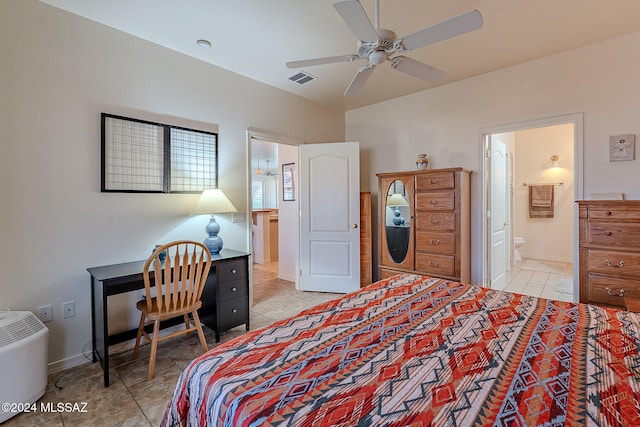 bedroom featuring light tile patterned flooring, ceiling fan, and connected bathroom