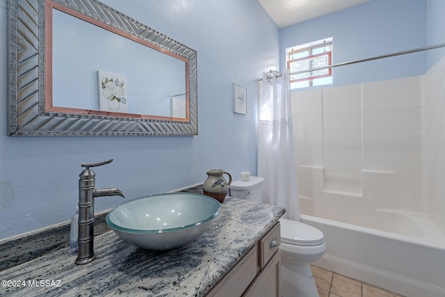 full bathroom with vanity, tile patterned floors, shower / bathtub combination with curtain, and toilet