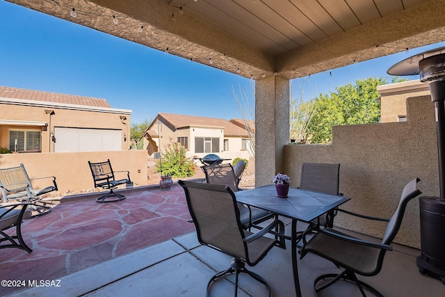 view of patio / terrace featuring fence and outdoor dining space