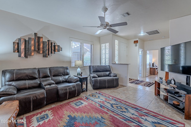 living room with light tile patterned flooring and ceiling fan