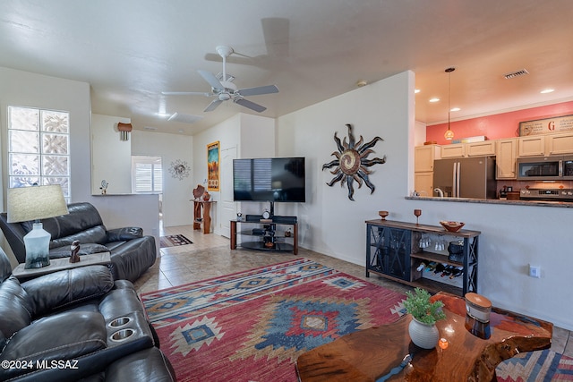 living room featuring light tile patterned floors and ceiling fan