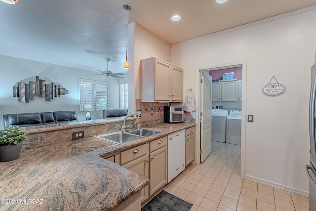 kitchen with separate washer and dryer, dishwasher, sink, ornamental molding, and light brown cabinets