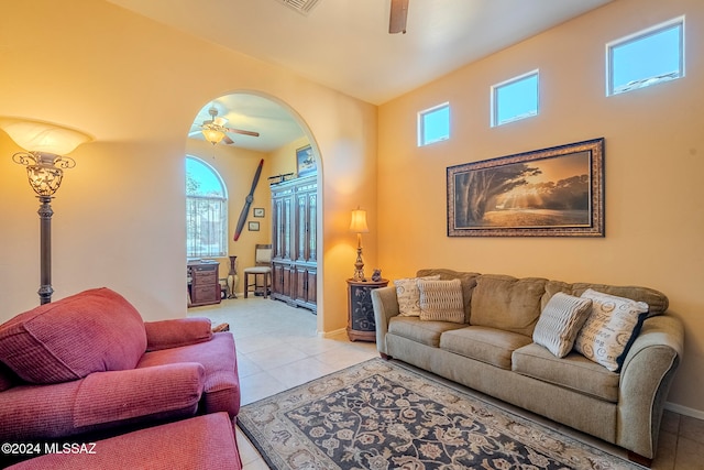 living room featuring light tile patterned flooring and ceiling fan