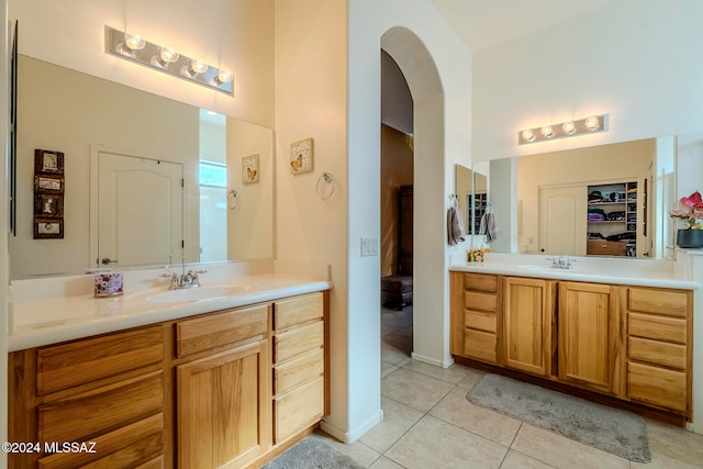 bathroom featuring tile patterned flooring and vanity