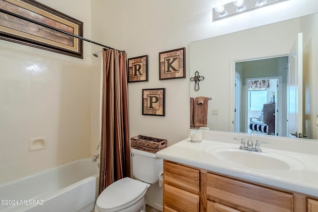 full bathroom with shower / bath combo, vanity, and toilet