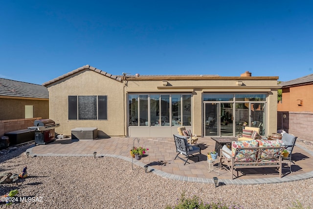 rear view of property featuring a patio area