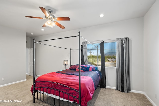 carpeted bedroom featuring ceiling fan