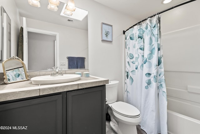 full bathroom with vanity, toilet, and shower / tub combo with curtain