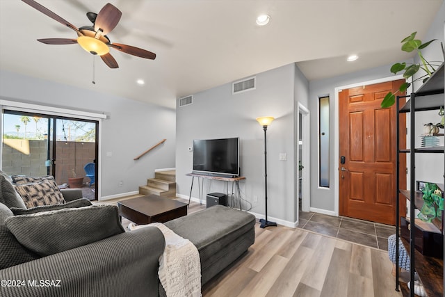 living room featuring hardwood / wood-style flooring and ceiling fan