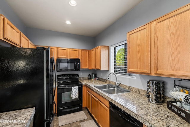 kitchen with black appliances and sink