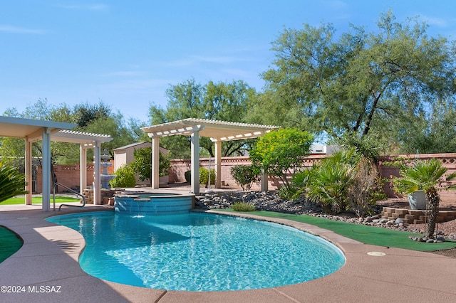 view of swimming pool with a patio area and a pergola