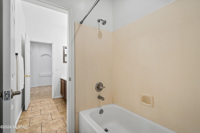 bathroom featuring vanity, tile patterned flooring, and tub / shower combination